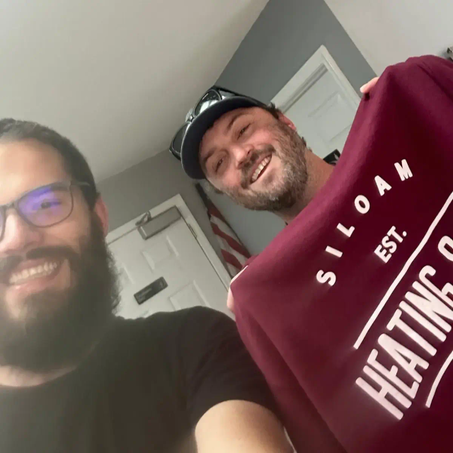 John from Splor with a client from Siloam Springs Heating and Air